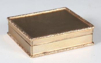 A mid-20th century 9ct gold rectangular box with overall machine eng