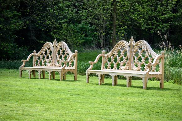 DreweattsA LARGE PAIR OF CARVED TEAK LATTICE BACK GARDEN BENCHES, CONTEMPORARY