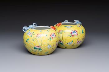 A pair of Chinese famille rose yellow-ground water pots with floral design and applied chilong and bats, Qianlong mark, 19/20th C.