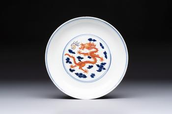 A Chinese blue and white iron-red-decorated 'Dragon' plate, Jing Jin Tang 精進(jìn)堂 mark, 19th C.