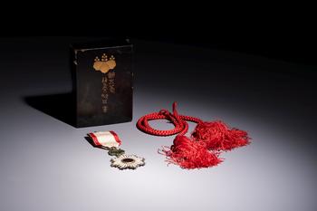 A Japanese Order of the Rising Sun, Fifth Class, in its original lacquer box, Meiji, 19/20th C.