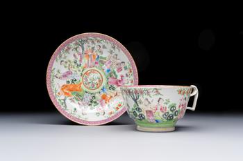 A Chinese Canton famille rose cup and saucer with figures in a garden, 19th C.