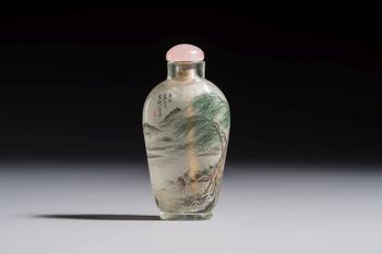A Chinese inside-painted glass snuff bottle with two men wearing straw raincoats, dated 1911