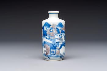 A Chinese blue, white and copper-red snuff bottle with narrative design, 19th C.