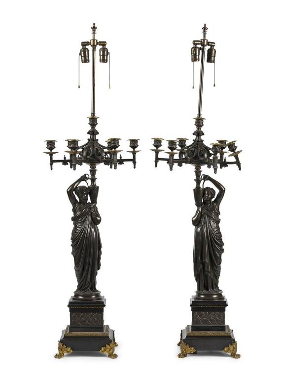 A Pair of Continental Bronze Figural Seven-Light Candelabra Mounted as ...