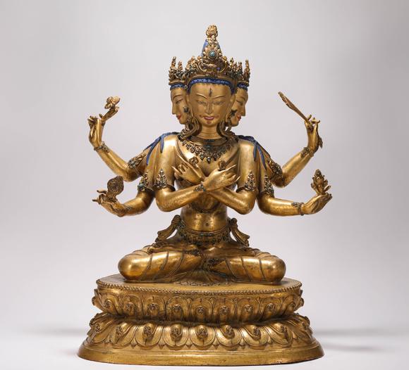 liaodu art auction清代铜鎏金三头六臂佛造像  a bronze gilt three