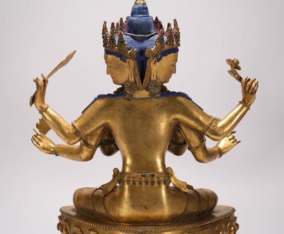 liaodu art auction清代铜鎏金三头六臂佛造像  a bronze gilt three